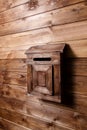 Wooden mailbox on wood wall background Royalty Free Stock Photo