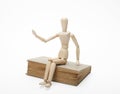 Wooden man and book Royalty Free Stock Photo