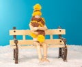 The wooden man figure on bench in the freezing Royalty Free Stock Photo