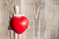 Wooden man figure holding a red heart ball. Royalty Free Stock Photo