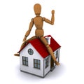 The wooden man sitting on the roof of the house Royalty Free Stock Photo