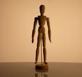 Wooden man toy on beige background Royalty Free Stock Photo