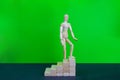 Wooden man walk up the career stairs. Ladder made with wooden bricks. Mannequin on top of development. Concept of personal