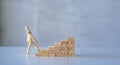 wooden man walking up the career ladder Wooden brick ladder, concept Royalty Free Stock Photo