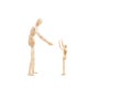 A wooden manequin toy with arms raised and other trying to take it