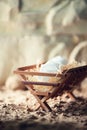 Wooden manger and star of Bethlehem in cave, nativity scene background. Christian Christmas concept. Birth of Jesus Royalty Free Stock Photo