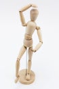 A wooden mannequin in a ballet pose.