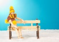 Wooden mannequin on bench