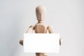 Wooden mannequin with a business card. Royalty Free Stock Photo