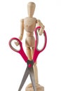 Wooden Mannequin Carrying a Pair of Scissors Royalty Free Stock Photo