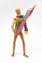 Wooden mannequin with colorful paints, back to school