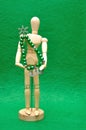 A wooden mannequin display with a christmas tree made out of wire and beads Royalty Free Stock Photo