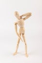 Wooden mannequin figure expressing neck pain Royalty Free Stock Photo