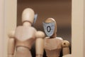 Wooden mannequin figurine looking in mirror with mask with zero symbol, low self-esteem concept. Royalty Free Stock Photo