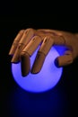 Wooden mannequin hand, light bgall, fortune teller