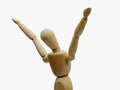 Wooden mannequin with hands up exulting isolated on white back view Royalty Free Stock Photo