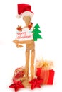 Wooden mannequin holding christmas card