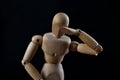 Wooden Mannequin Looking Sad And Depressed On Black Background Royalty Free Stock Photo