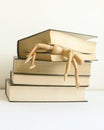 Wooden mannequin manikin student fell under pressure and was killed, crush studying and learning by bunch of books. Royalty Free Stock Photo