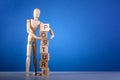 Wooden mannequin near the tower of cubes with the inscription Posture