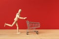 Wooden mannequin running for sales Royalty Free Stock Photo