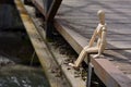 Wooden mannequin sitting Royalty Free Stock Photo