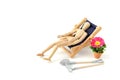 Wooden mannequin taking sunbath in deck chair Royalty Free Stock Photo