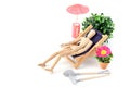 Wooden mannequin taking sunbath in deck chair Royalty Free Stock Photo