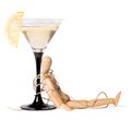 Wooden mannikin strapped to the glass of vermouth. Concept of drunkenness, alcohol abuse Royalty Free Stock Photo