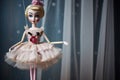 wooden marionette with painted face, dressed in a ballerina tutu