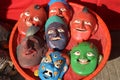 Wooden mask with funny faces and angry face kept in a basket in the market of Nepal to sell.Colorful Wooden Mask Collection