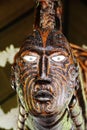 Wooden mask with intricate patterns. Rotorua, New Zealand Royalty Free Stock Photo