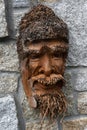 Wooden mask of man with beard