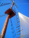 Wooden mast and white netlike sail