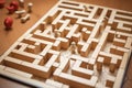 Wooden maze game with human figure inside finding direction to exit