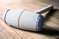 A Wooden Meat Mallet Lying Down On A Table Royalty Free Stock Photo