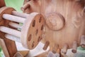 Wooden mechanical transmission. The restoration of the old mechanism of a gear transmission. Retro mechanics of the Renaissance