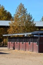 Row of Wooden shedrow stabling at Twin Rivers Ranch