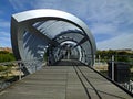 Wooden and metal bridge with beautiful geometric shapes and intense blue skay, Puente de Arganzuela, Madrid, Spain