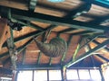 Wooden-metal roof constriction and decorative hanging pot