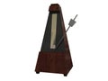 Wooden metronome on white surface Royalty Free Stock Photo