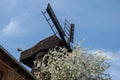 Wooden Mill on blue sky background. Old Windmill at dawn. Windmill farm. Rural landscape village on the hill in Trzew Royalty Free Stock Photo