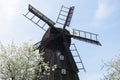 Wooden Mill on blue sky background. Old Windmill at dawn. Windmill farm. Rural landscape village on the hill in Trzew Royalty Free Stock Photo