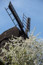 Wooden Mill on blue sky background. Old Windmill at dawn. Windmill farm. Rural landscape village on the hill in Trzew Royalty Free Stock Photo