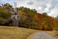 Wooden mill. Cloudy autumn day in a countryside mill village. Autumn rural landscape Royalty Free Stock Photo