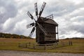 Wooden mill. Cloudy autumn day in a countryside mill village. Autumn rural landscape Royalty Free Stock Photo