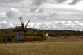 Wooden mill. Cloudy autumn day in a countryside mill village. Autumn rural landscape Royalty Free Stock Photo