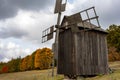 Wooden mill. Cloudy autumn day in a countryside mill village. Autumn rural landscape Royalty Free Stock Photo