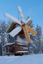 Wooden mill covered with snow, tourist complex Malye Karely, Arkhangelsk region, Russia Royalty Free Stock Photo