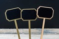 Wooden mini blackboard labels over chalkboard background